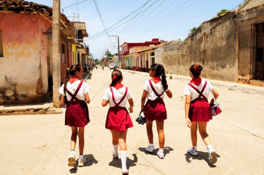 (GERMANY OUT) Cuba Santiago de Cuba - Trinidad: school girls waering school uniform on the way home - 01.06.2009 (Photo by Konzept und Bild/ullstein bild via Getty Images)